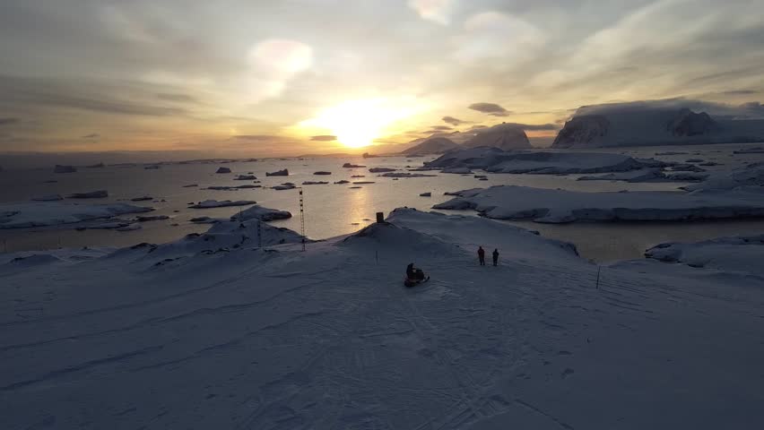 Nacreous Clouds Over Antarctica with People Below, Aerial Drone View