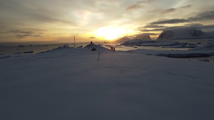 Nacreous Clouds Over Antarctica with People Below, Aerial Drone View