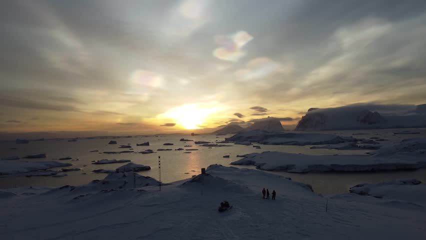 Nacreous Clouds Over Antarctica with People Below, Aerial Drone View