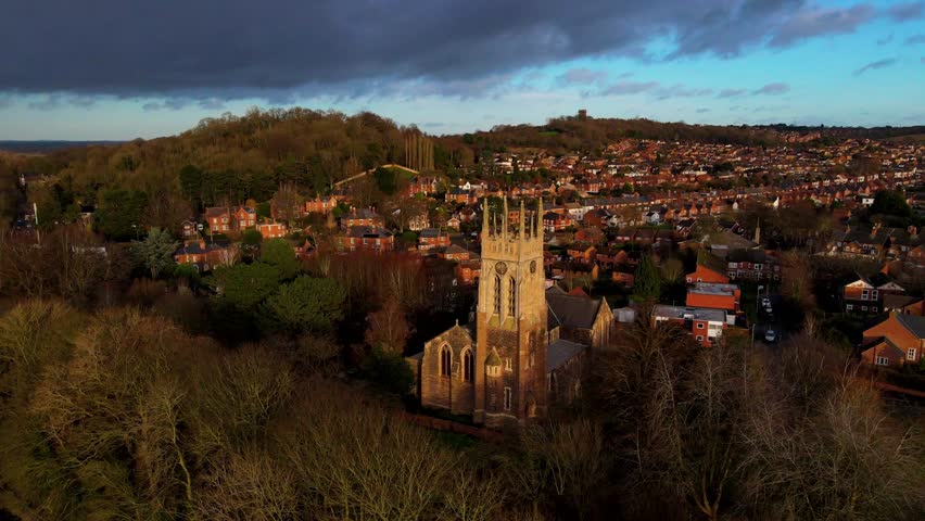 Aerial view of St Peters Bridge and church surrounded by autumn trees