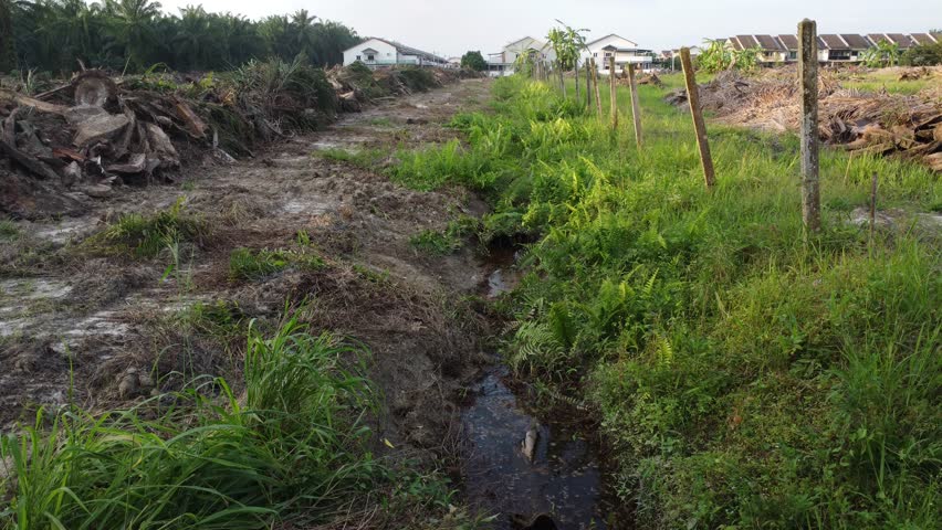 aerial footage of a simple man-made drainage system at the plantation land. 