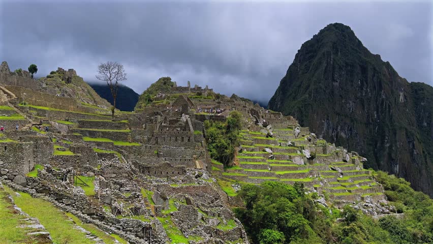 Machu Picchu circuit one morning shihuahuaco tree chihuahuaco Peru Perú aerial sunny blue sky clouds rainy season lush green jungle Huayna Picchu mountain Peruvian Andes Inca Temple Sanctuary static