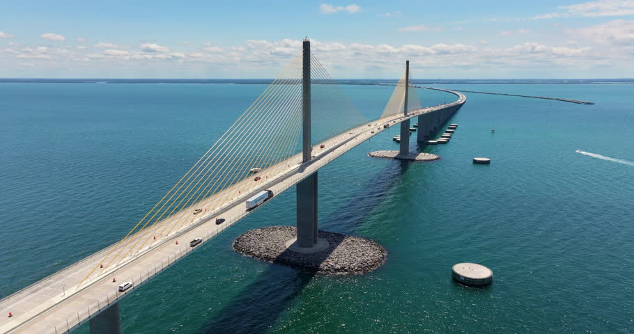 Cars driving on Sunshine Skyway Bridge over Tampa Bay in Florida. Transportation infrastructure in America