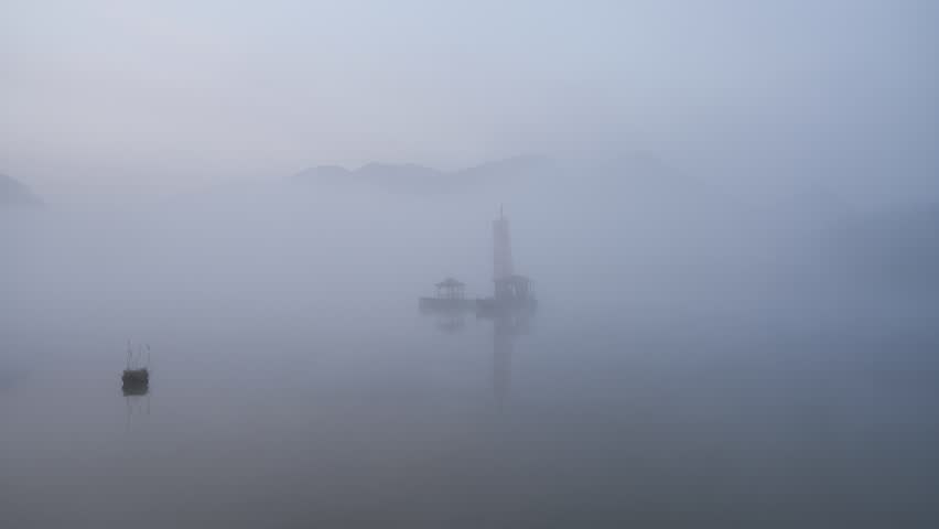 Breathtaking 4K UHD aerial time-lapse footage of Shennongjia Dajiuhu’s iconic alpine wetland scenery—nine connected lakes nestled among mountains, shrouded in ethereal morning mist and glowing under golden hour sunlight. Capturing cloud seas drifting over lush meadows, crystal-clear lakes reflecting sky and ridges, and the serene harmony of this peat bog ecosystem, the video embodies the "wetland in clouds" charm. Perfect for Shutterstock users—ideal for travel promotions, eco-tourism campaigns, nature documentaries and commercial projects seeking striking Chinese alpine wetland content.