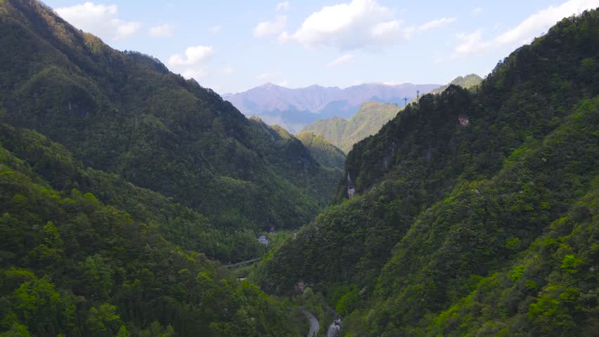 Breathtaking 4K UHD aerial time-lapse footage of Shennongjia Dajiuhu’s iconic alpine wetland scenery—nine connected lakes nestled among mountains, shrouded in ethereal morning mist and glowing under golden hour sunlight. Capturing cloud seas drifting over lush meadows, crystal-clear lakes reflecting sky and ridges, and the serene harmony of this peat bog ecosystem, the video embodies the "wetland in clouds" charm. Perfect for Shutterstock users—ideal for travel promotions, eco-tourism campaigns, nature documentaries and commercial projects seeking striking Chinese alpine wetland content.