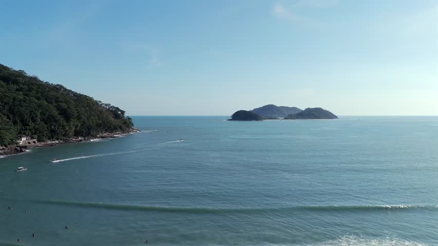 Boats sailing on calm seas on sunny day off the Brazilian coast. Aerial