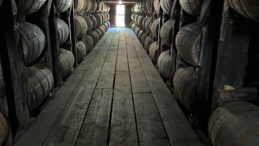 Barrels Of Whiskey Bourbon Aging And Maturing In A Cold Climate Basement Cellar In A Distillery.