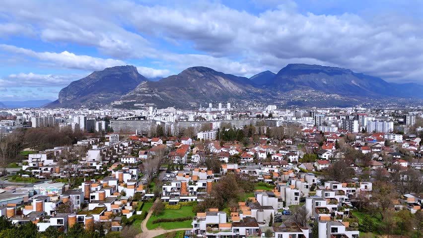180 degree panorama of Grenoble city with dense urban area, mountain landscape