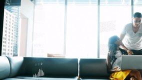 Asian woman working on laptop with man handing report to colleague unveiling animated analytics. Collaboration, teamwork, data analysis, modern office, business meeting, professional, analytics - Powered by Shutterstock - Get 15% off with code: PIKWIZARD15