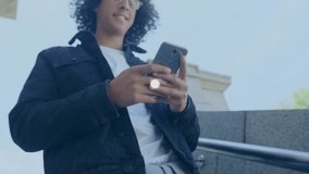 Animation of connections and globe over happy man using smartphone outdoors. global network, connections and data processing concept digitally generated video. - Powered by Shutterstock - Get 15% off with code: PIKWIZARD15