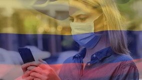 Animation of waving colombia flag over caucasian woman in face mask using smartphone on the street. Global covid-19 pandemic concept - Powered by Shutterstock - Get 15% off with code: PIKWIZARD15