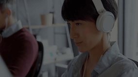 Animation of data processing over diverse colleagues working in office. Business, technology and digital interface concept digitally generated video. - Powered by Shutterstock - Get 15% off with code: PIKWIZARD15