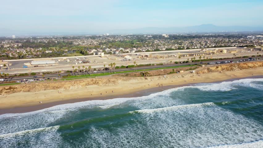 Coastal sunset view of Huntington Beach, Orange County, California - Pacific West Coast. Aerial Landscape looking toward residential ocean front neighbourhoods along PCH Highway 1