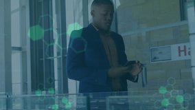 Animation of data processing over african american businessman using smartphone. Global business, finances and digital interface concept digitally generated video. - Powered by Shutterstock - Get 15% off with code: PIKWIZARD15