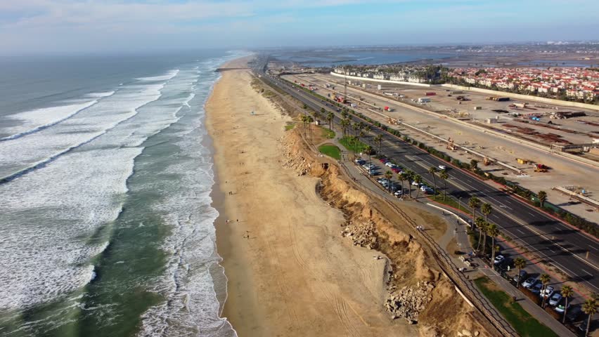 Coastal sunset view of Huntington Beach, Orange County, California - Pacific West Coast. Aerial Landscape Looking from Dog Beach toward Bolsa Chica along PCH Highway 1