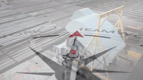 Animation of compass with arrow pointing to teamwork text over industrial machinery. Education, work, industry, goals, direction and communication, digitally generated video. - Powered by Shutterstock - Get 15% off with code: PIKWIZARD15