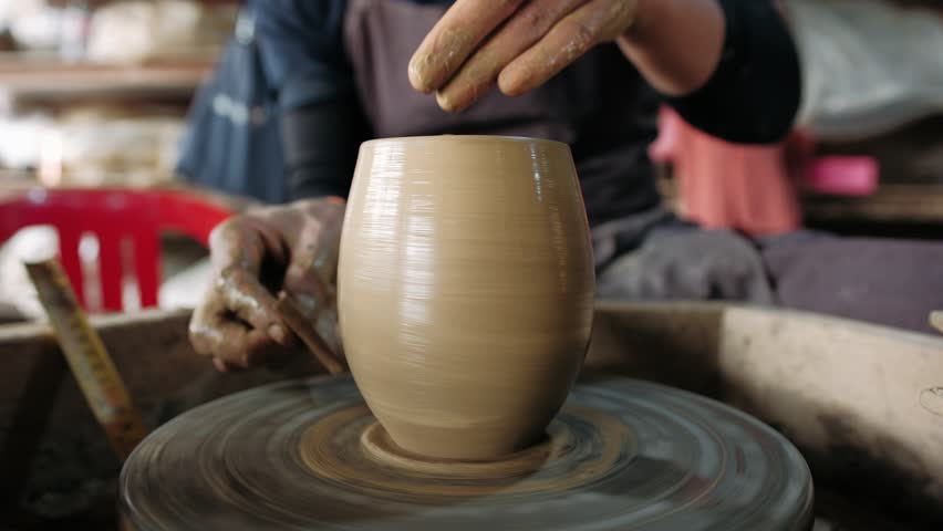 Potter work with clay on workshop. A creative process of making ceramic pottery in a workshop, Siem Reap, Cambodia 