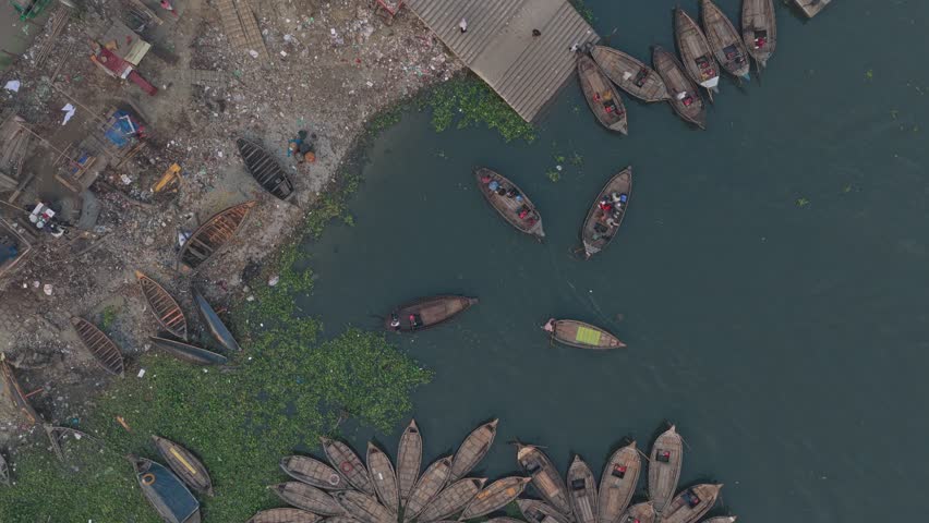 Busy river scene with rowboats on Buriganga River in Dhaka, Bangladesh