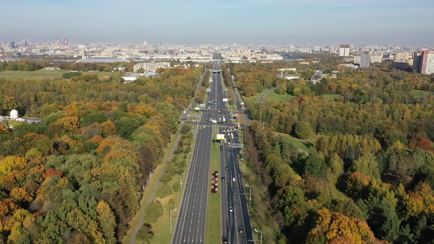 Drone flying along highway toward intersection