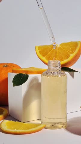 Vitamin C Serum Dropper Bottle with Fresh Oranges for Skincare
