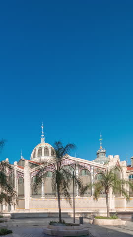Panorama showing Valencia Central Market timelapse. Historic public market with stunning architecture, stained glass, dome and tile details. Located in Market Square near Santos Juanes Church. Spain