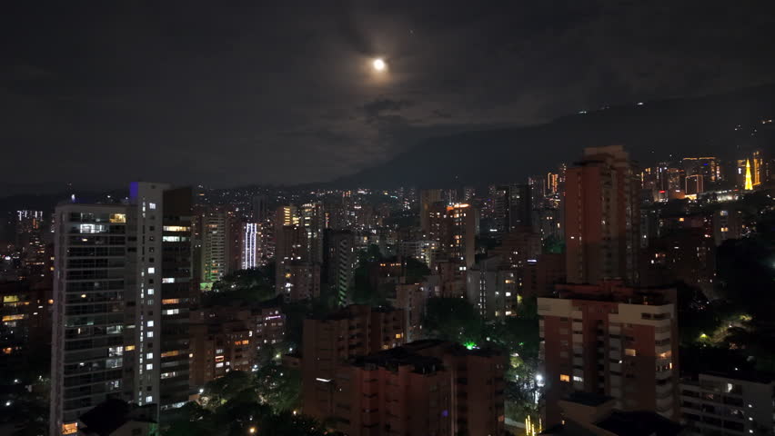 Capture the dazzling nighttime skyline of Medellin