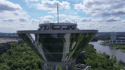 Drone Flying Smoothly around Tall Office Tower