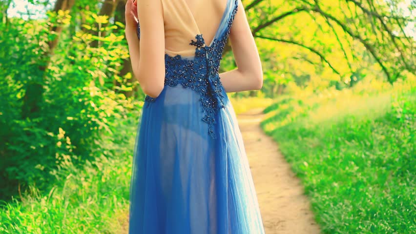 silhouette person close-up young beauty woman back rear view holiday hairstyle brunette hair evening hairdo neck shoulder skin. hairpins with fresh blue flowers elegant decor blue adult girl sexy.