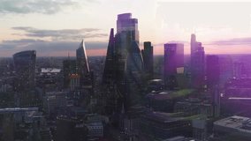 Elevated pan over modern office buildings in London’s financial district with digital lines and charts visualizing data and financial analytics. - Powered by Shutterstock - Get 15% off with code: PIKWIZARD15