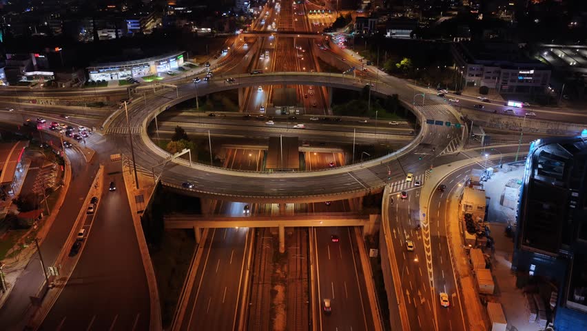 Aerial drone cinematic night video of multilevel junction ring road passing through city centre 