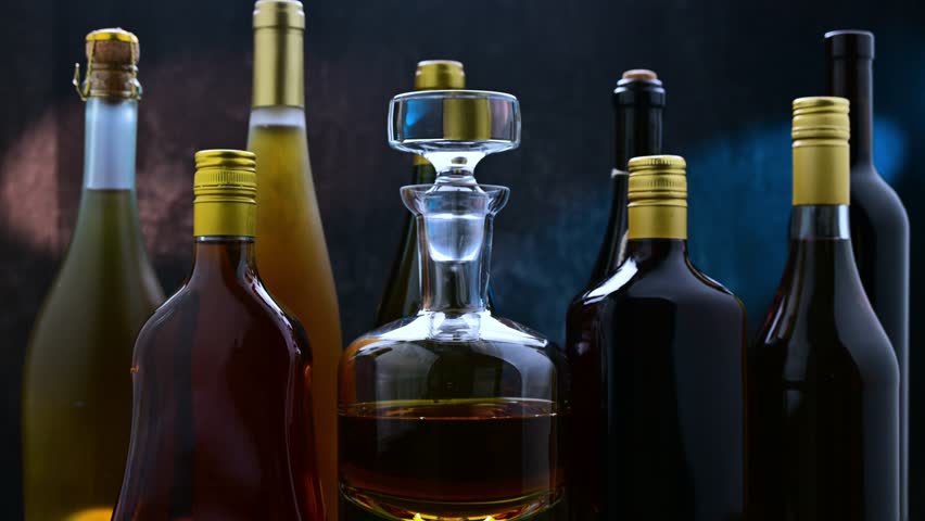 Bottles and carafes of assorted alcoholic beverages.