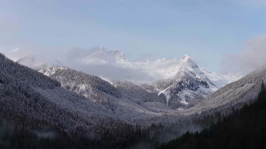 Majestic Snow-Capped Mountains and Winter Forest in British Columbia, Canada