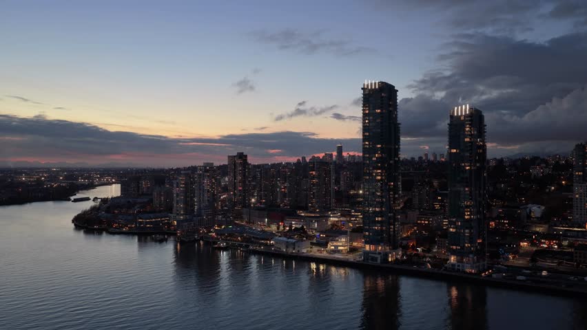 Aerial View of New Westminster Skyline at Dusk, Fraser River Reflecting City Lights in British Columbia, Canada