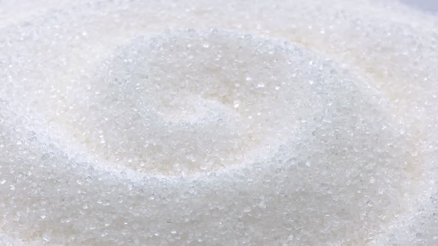 Pure white sugar crystals texture for sweet culinary baking concepts