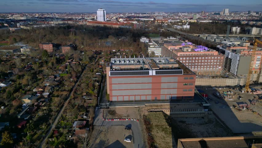 datacenter building with quantum computer science and technology park in Berlin City with modern buildings, urban skyline. Beautiful aerial view drone top down Above view