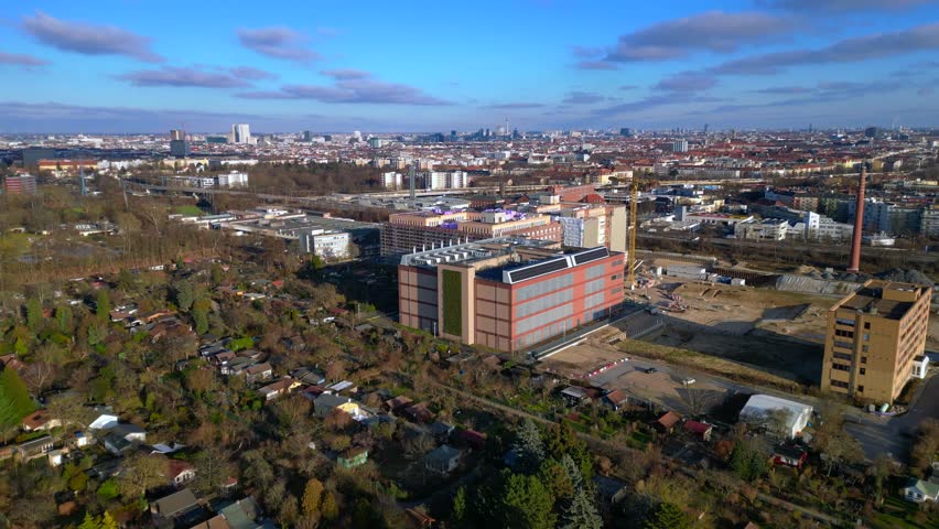 datacenter building with quantum computer science and technology park in Berlin City with modern buildings, urban skyline. Gorgeous aerial view fly push forward drone