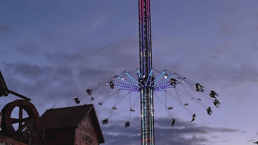 Cannstatter Volksfest or Octoberfest, beer festival and traveling funfair in Stuttgart, Germany, Oktoberfest 2023. With high up marry go round