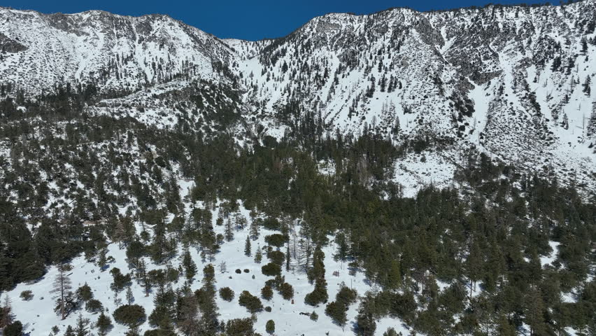 Epic Winter Scenery Aerial Views of Snow Covered Mountains Orbit R in San Gabriel Mts California USA