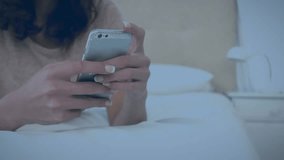 Animation of data processing over caucasian woman using smartphone. Global business and digital interface concept digitally generated video. - Powered by Shutterstock - Get 15% off with code: PIKWIZARD15