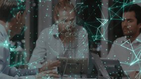 Left colleague gesturing over tablet activating network overlay, rotating globe in business meeting. Collaboration, technology, networking, innovation, teamwork, professional, digital - Powered by Shutterstock - Get 15% off with code: PIKWIZARD15