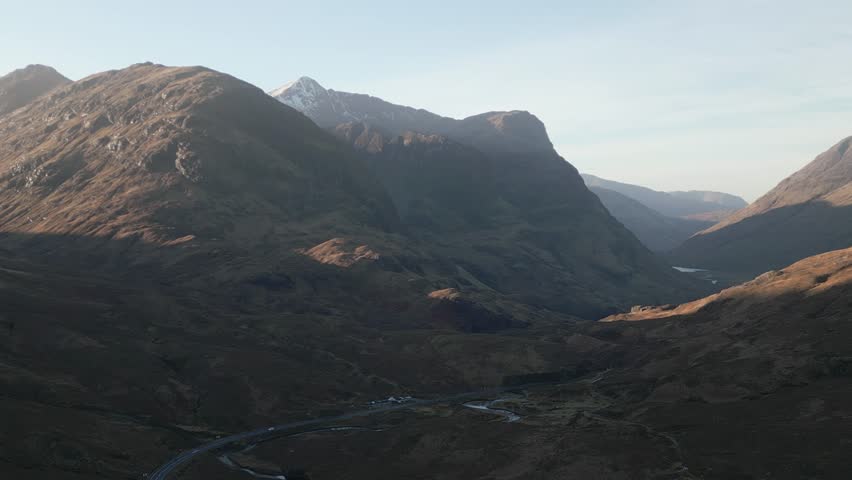 Aerial view of the iconic Glen Coe valley in the scottish highlands. Drone flying to the right.