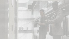 colleagues analyzing business data in office, showing digital bar chart and line graph overlay. Technology, analytics, innovation, workspace, collaboration, modern, professional - Powered by Shutterstock - Get 15% off with code: PIKWIZARD15