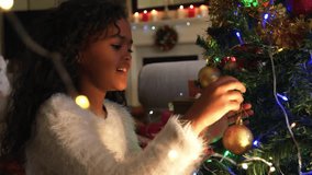 Animation of feliz navidad text over happy girl at christmas. Christmas, celebration and digital interface concept digitally generated video. - Powered by Shutterstock - Get 15% off with code: PIKWIZARD15