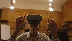 Animation of digital icons and data processing over caucasian man wearing vr headset at office. Futuristic business technology concept - Powered by Shutterstock - Get 15% off with code: PIKWIZARD15