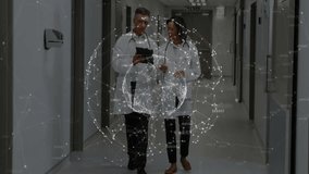 Two doctors walking corridor while hologram materializing rotating around tablet for data review. Medical technology, digital interface, collaboration, innovation, futuristic, healthcare, professional - Powered by Shutterstock - Get 15% off with code: PIKWIZARD15
