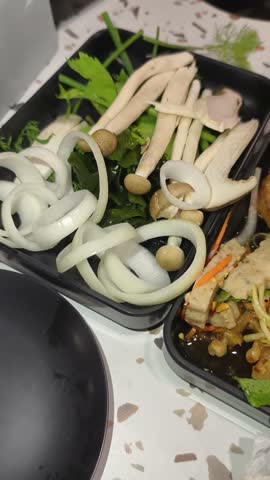 This video features a shabu-shabu restaurant in Thailand that offers a wide variety of food types, including meat and fruit. sstkVertical