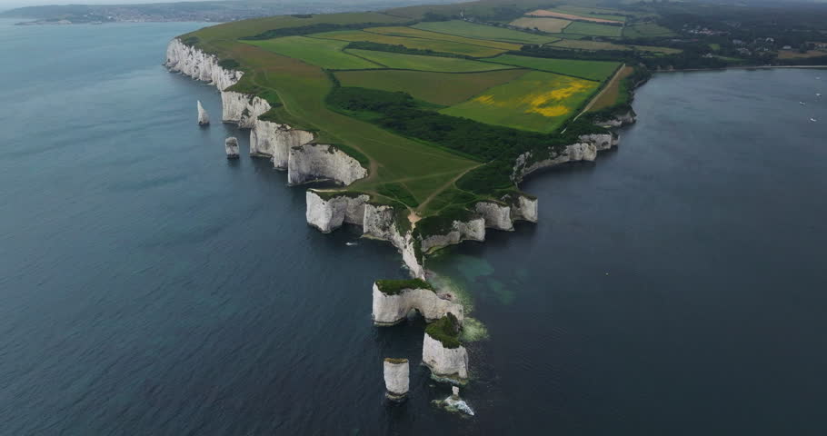 Aerial View Of Old Harry Rocks, Green Fields, And English Channel In England, UK.