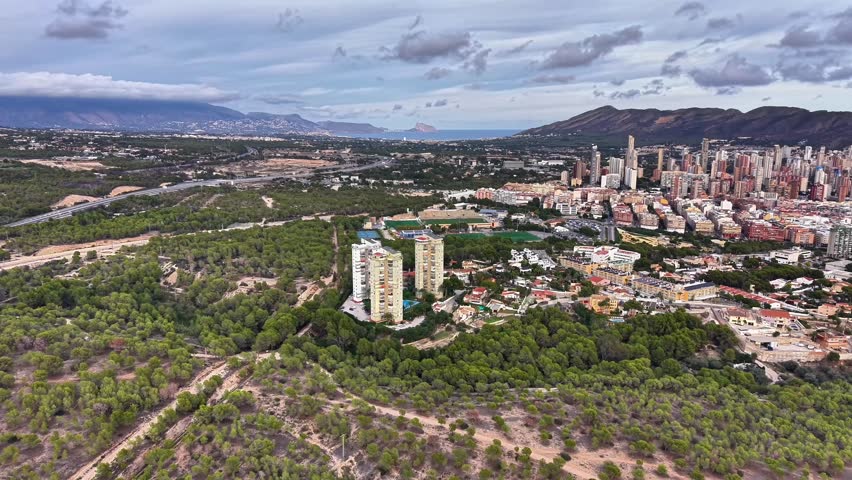 Greenbelt Aerial Shot Showing Residential Cluster And Distant City Skyline For Ecotourism Promotion, Tree