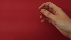 Throwing the dice. Red cubes with white dots on red background. Playing board games, gambling, winning or loosing in the casino. Slow motion closeup video. - Powered by Shutterstock - Get 15% off with code: PIKWIZARD15