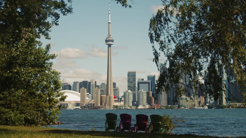 Scenic Toronto City Skyline Featuring CN Tower Modern Buildings And Boats Along Lake Ontario Waterfront Representing Travel Urban Architecture And Iconic Canadian Metropolis